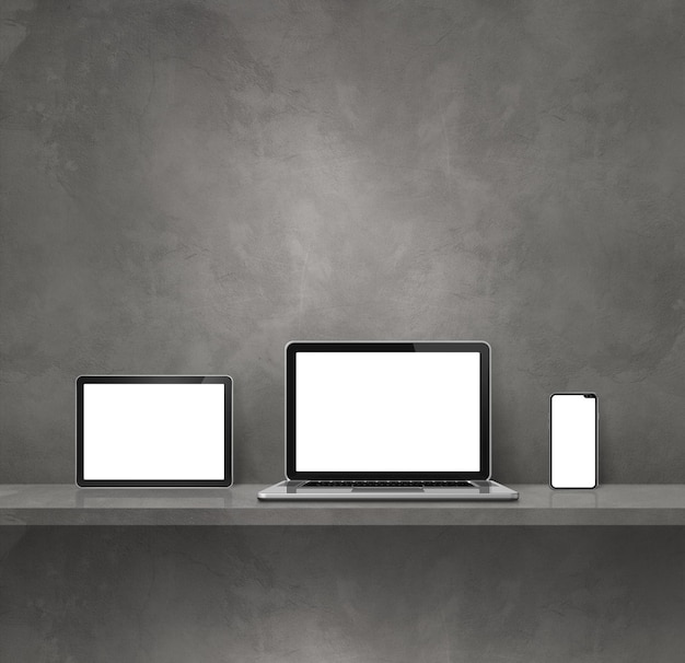 Laptop mobile phone and digital tablet pc on grey wall shelf Square background