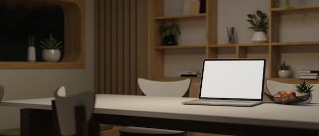 A laptop mockup on a dining table in a minimal cozy dining room Home workspace