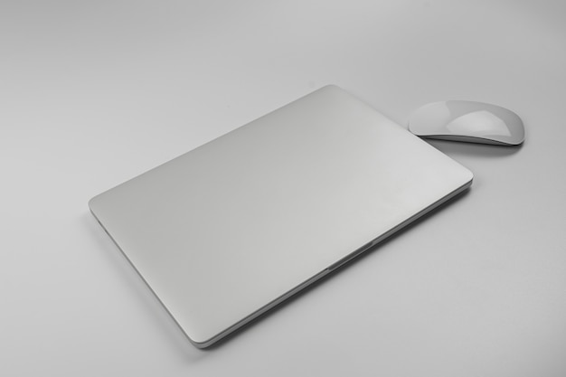 Laptop and mouse isolated on white