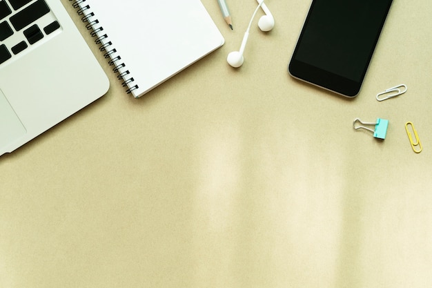 Laptop, notebook, mobile and accessories on table