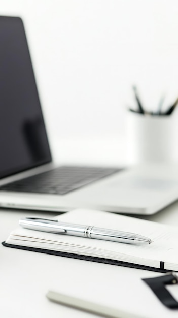 Laptop and Notebook on White Background with Copy Space