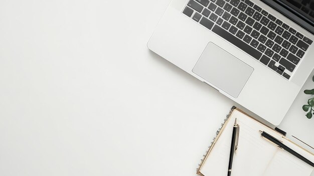 Laptop and Notebook on White Background with Copy Space