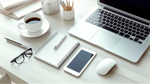 A laptop, a phone, and a cup of coffee are on a desk.