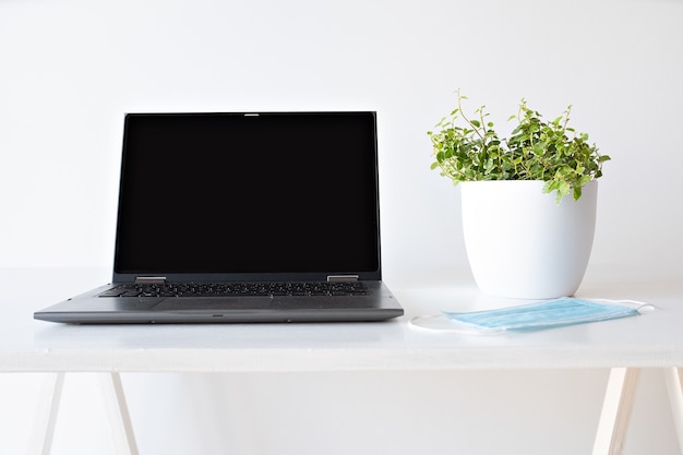 Laptop on white background and mask safe concept