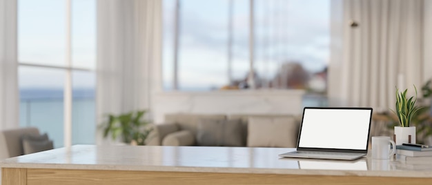 A laptop white screen mockup on a tabletop in a modern minimal living room 3d render 3d illustration