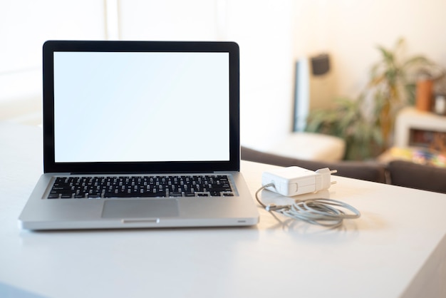 laptop on white table