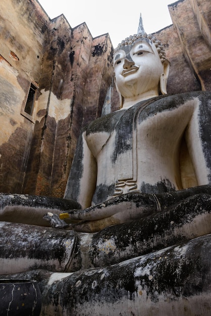 The large ancient Buddha statue in the ruined church