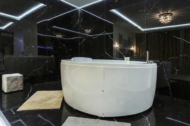 Large bathtub with massage spa in expensive apartment