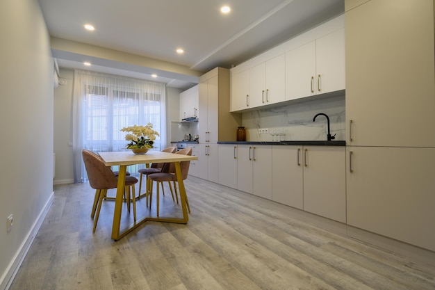 Large beige and cream luxury kitchen interior