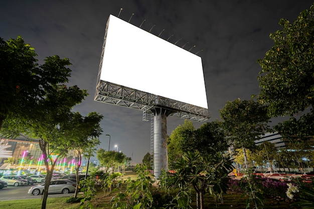 A large blank billboard the sunset sky the background