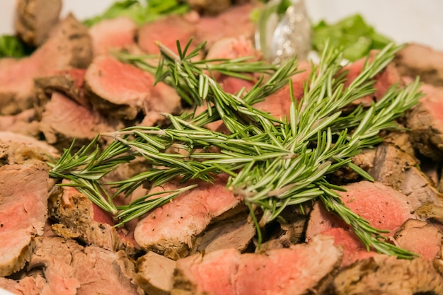 Large bowl of freshly roasted slices or prime beef for catering at a corporate event gala dinner banquet