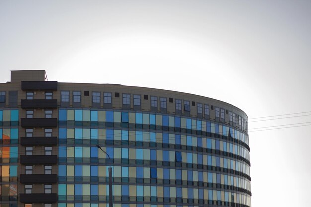 A large building with many windows and balconies dominates the cityscape