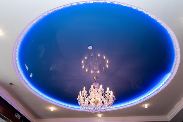 A large chandelier on the ceiling in the restaurant