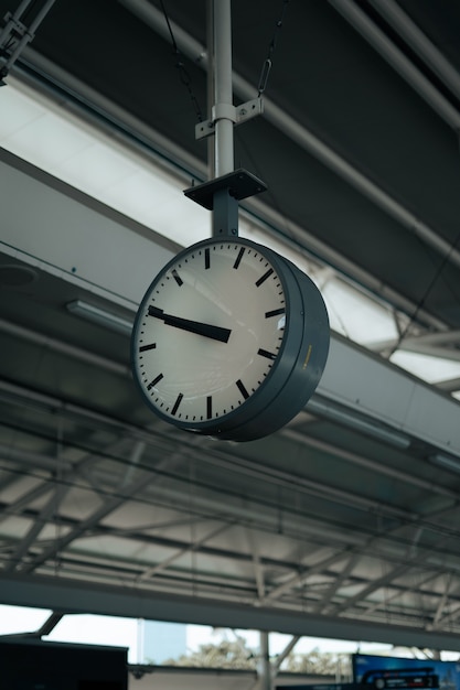 a large clock in a station