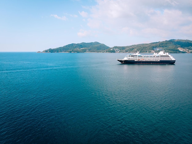 Large Cruise ship sailing across The Andaman sea - Aerial image. Beautiful  sea landscape