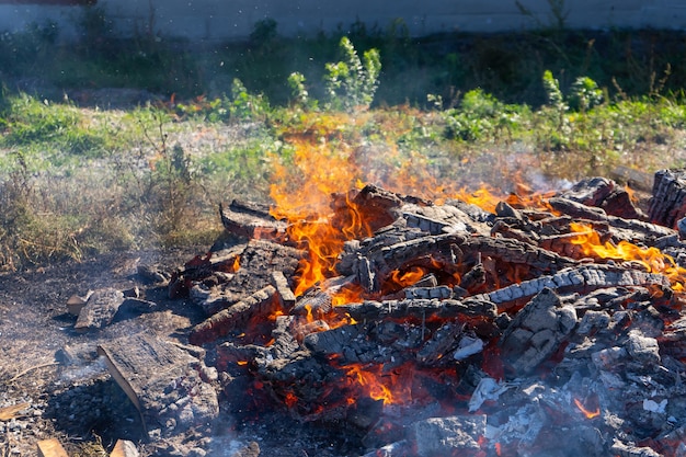 A large fire burning in the open.