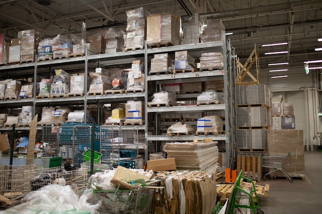 Large furniture warehouse with stuff on shelf in the store.