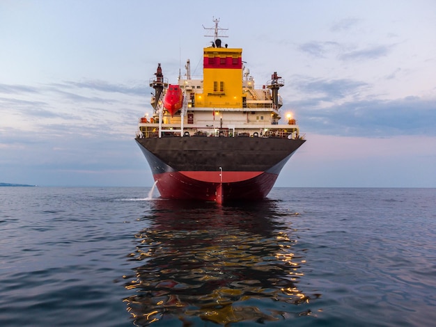 Large general cargo ship tanker bulk carrier aerial view at night