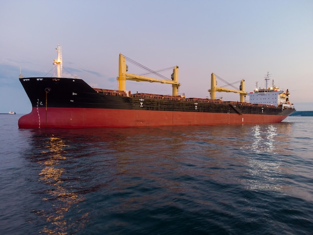 Large general cargo ship tanker bulk carrier aerial view at night