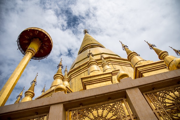 Large golden temple with sky background, Name is Phra Maha Chedi Srivang Chai, Lamphun, Th