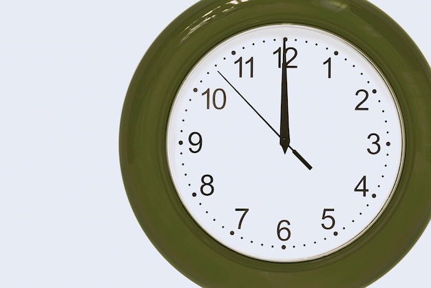 Large of green color analog clock show 12 hours at midnight or noon close-up