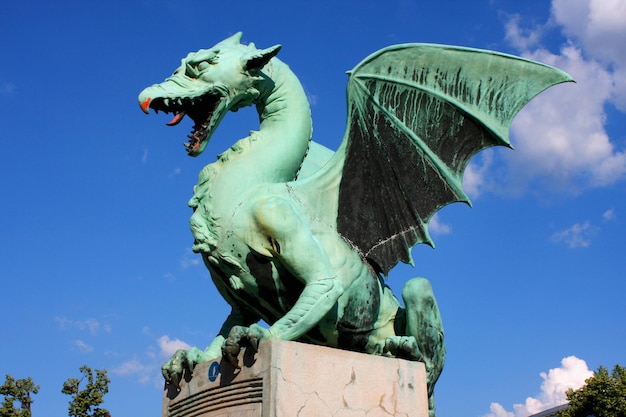 Large green Dragon bridge statue in Ljubljana Slovenia