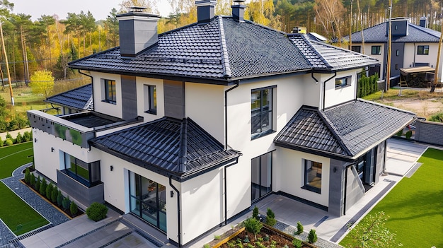 a large house with a black roof and a window that says quot zambezi quot