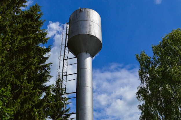 Large iron metal shiny stainless industrial water tower for supplying water with a large capacity