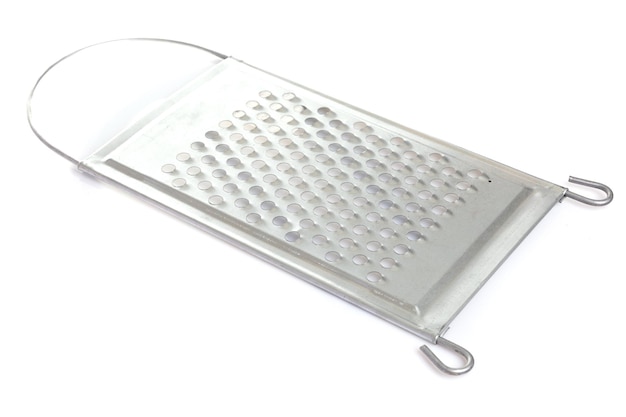 Large metal new grater on a white isolated background