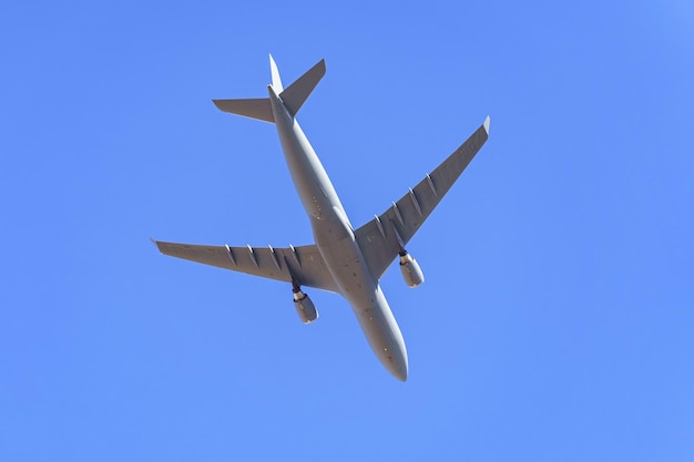 Large military transport plane flying low in a military parade of the armed forces