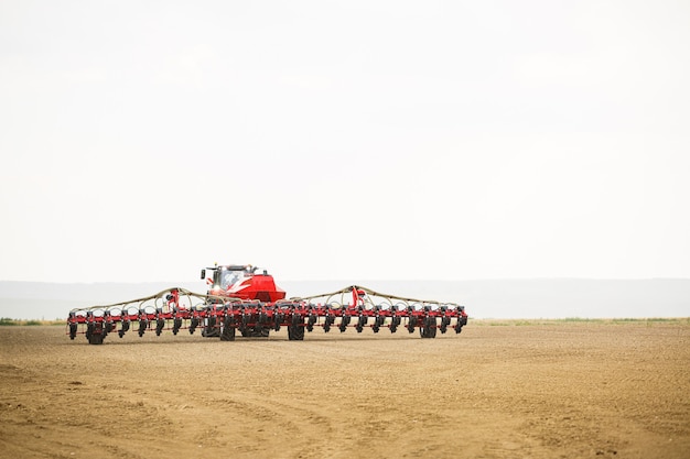 Large modern tractor for preparing the field after winter for sowing grain