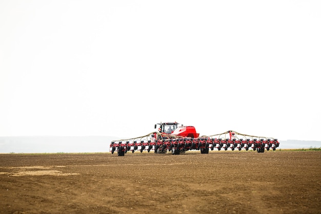 Large modern tractor for preparing the field after winter for sowing grain