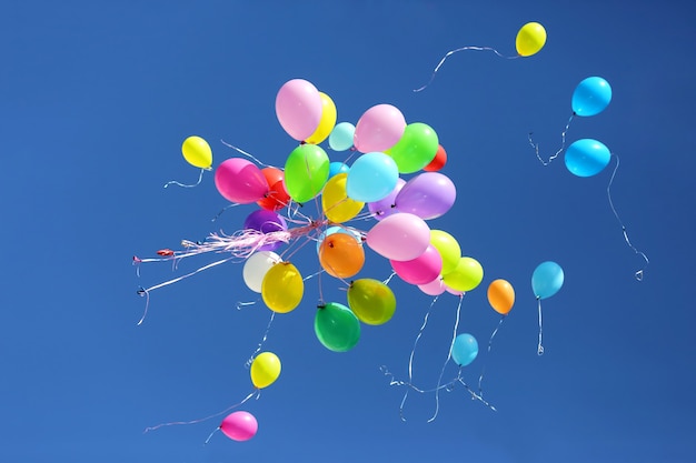 Large number of colorful balloons against the blue sky. Holiday Decorations