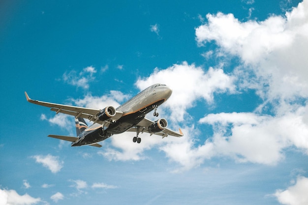 a large passenger jet flying through a cloudy sky