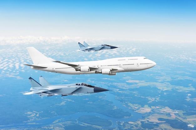 Large passenger plane accompanied by two military fighter Concept of airborne danger air force