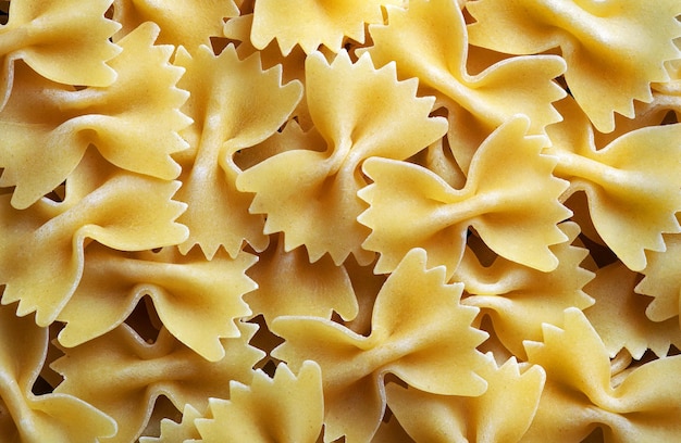 A large pile of pasta is shown on a white background.