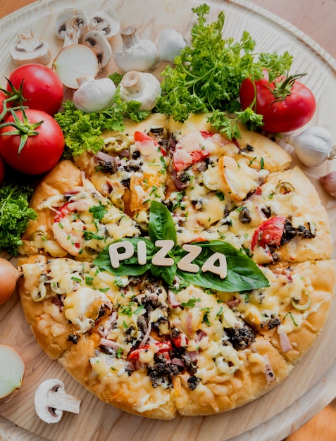 Large pizza on a wooden table. Restaurant.