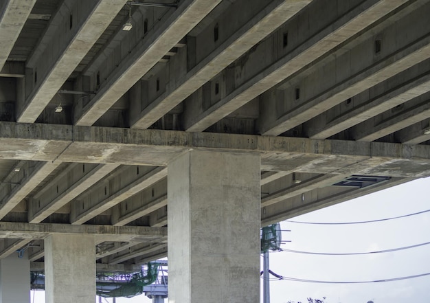 A large pole structure for electric trains or expressways. Background pattern of modern engineering