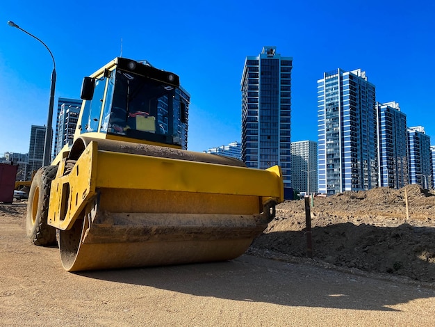 Large powerful modern yellow roller for asphalt paving repair and road construction New construction