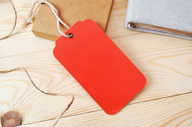 Large Price red Tag red tag on a golden wooden surface