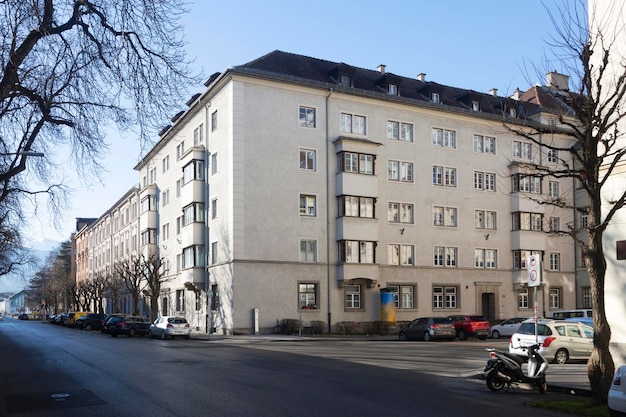 Large residential building and street with cars in Innsbruck Tyrol