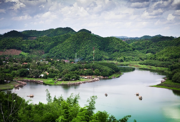 A large river surrounded by beautiful mountains