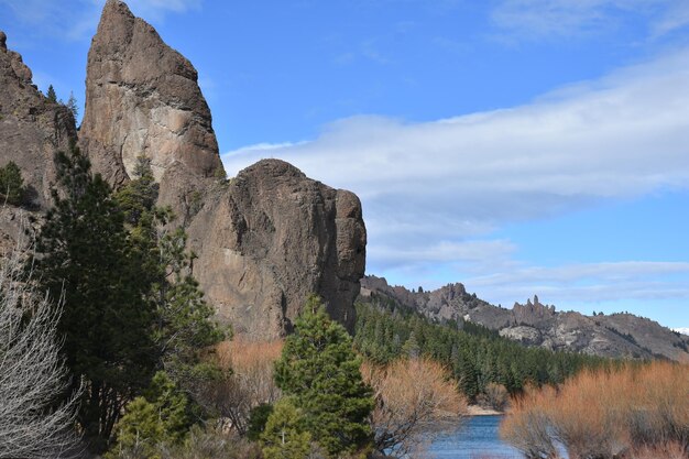 a large rock formation is in the middle of the picture