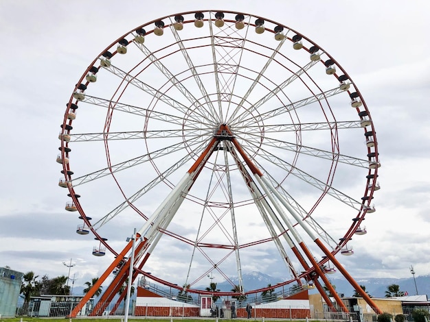 A large round beautiful Ferris wheel a panoramic platform in a park on a tropical sea warm summer