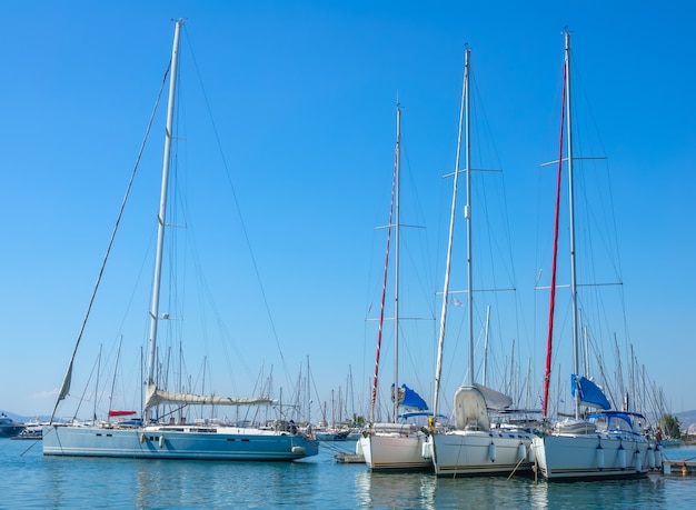 Large sailing yachts in the port on a sunny summer day