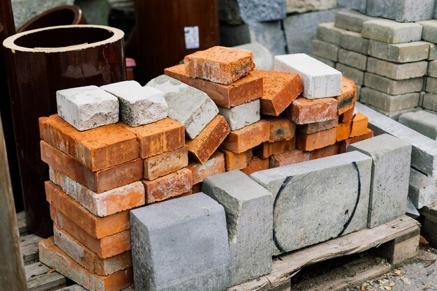 Large sectional sewer pipes, bricks, paves in warehouse construction