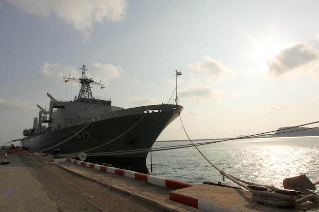 A large ship moored in the waiting for people.