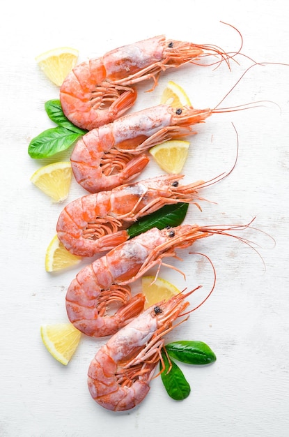 Large shrimp with lemon Top view Free space for your text On the old background