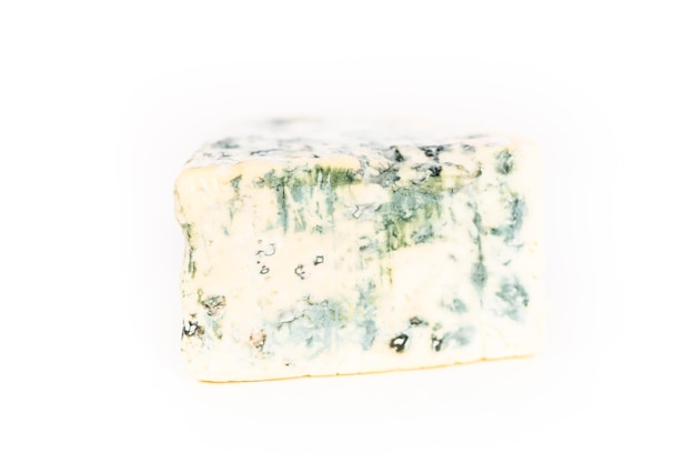 Large slice of blue cheese on a white background.