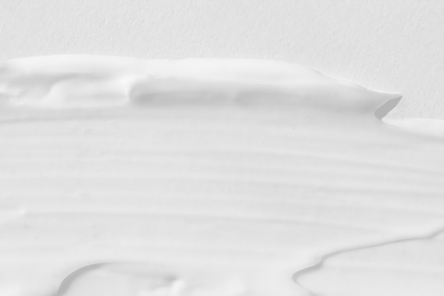 Large smears of white cosmetic cream The texture of the cream closeup